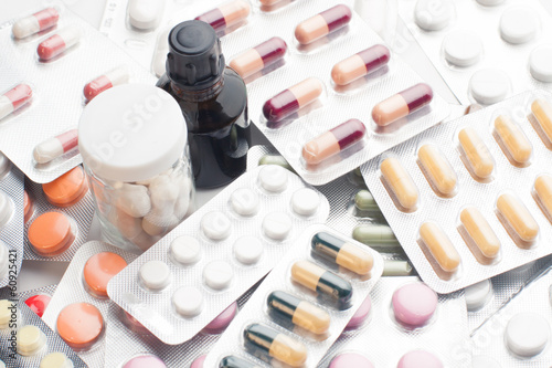 variety of tablets and pills background photo