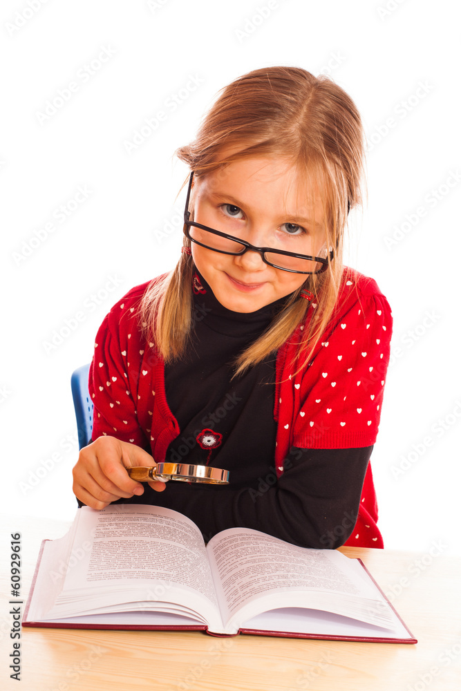 Cute little girl is reading a book Cute little girl is reading a book