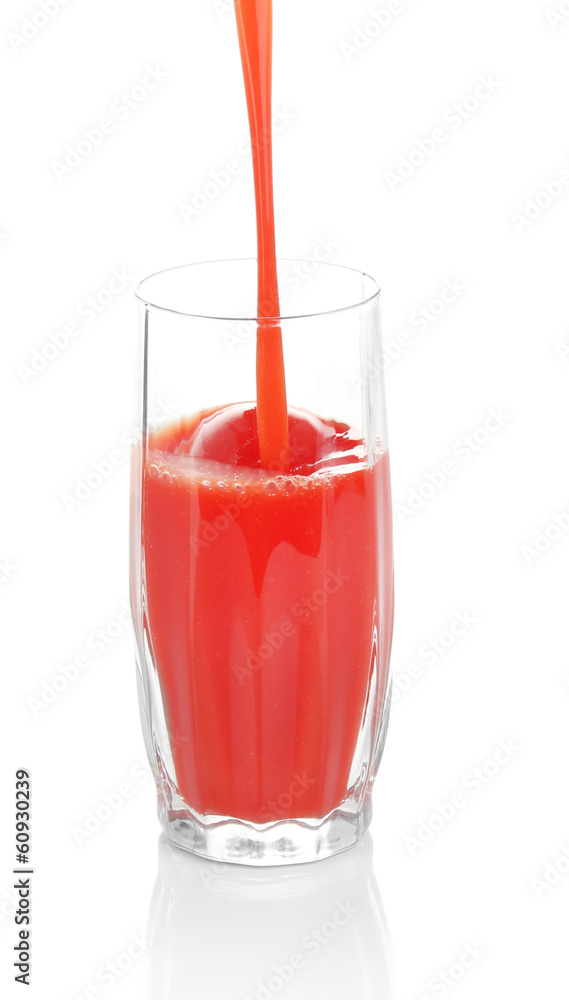 Juice pouring into glass isolated on white Juice pouring into glass isolated on white