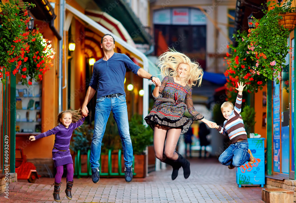 Obraz premium happy family jumping on colorful street