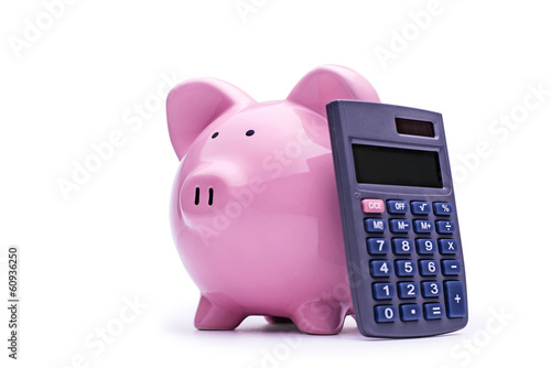 Pink piggy bank with a calculator