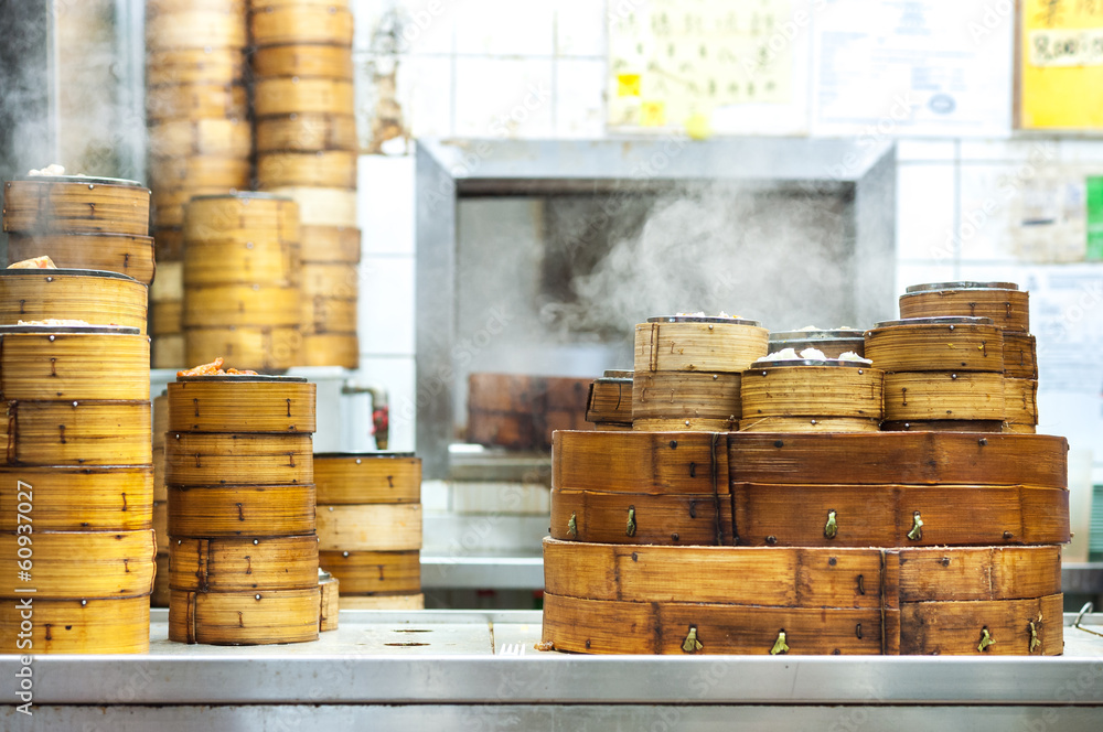 Obraz premium Stacked dim sum steamers at a Hong Kong restaurant