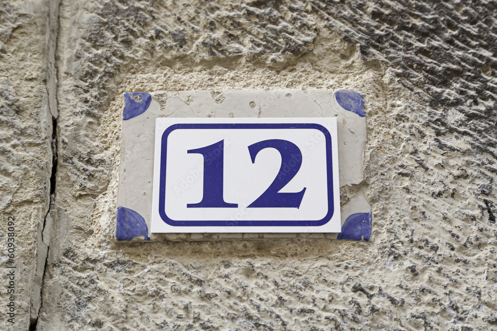 Number twelve on a plate on a wall Number twelve on a plate on a wall