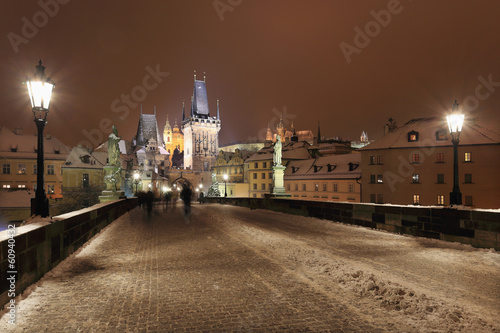 Night snowy Prague gothic Castle and St. Nicholas' Cathedral