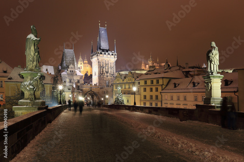 Night snowy Prague Castle with Sculptures from Charles Bridge