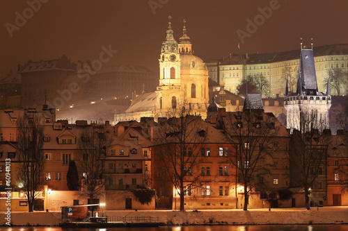 Night romantic snowy Prague St. Nicholas' Cathedral