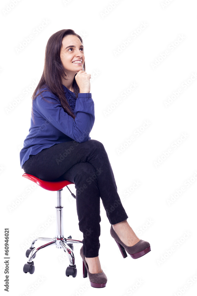 Fototapeta premium Pensive beautiful woman sitting on chair, isolated on white
