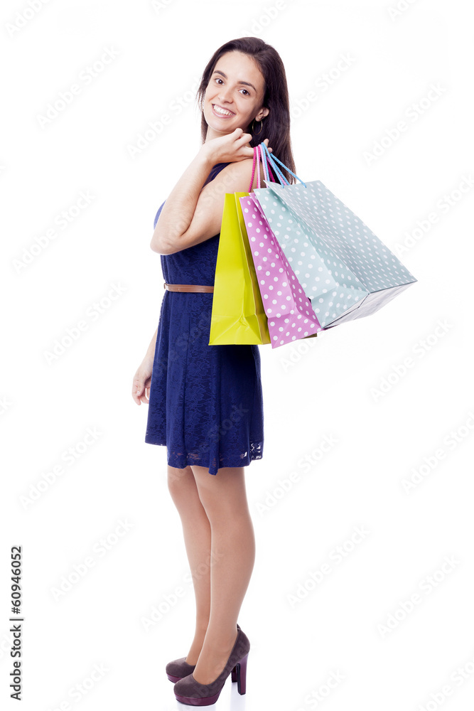 Lovely woman standing with shopping bags, isolated on white Lovely woman standing with shopping bags, isolated on white