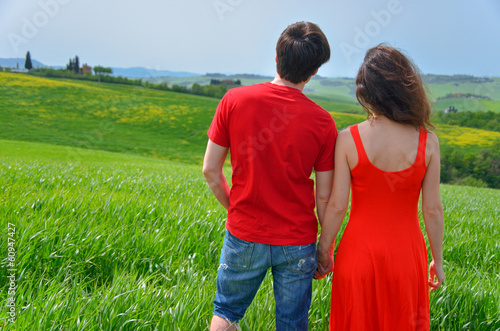 Romantic couple outdoors, vacations Tuscany, Italy