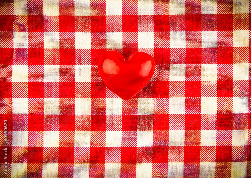 Obraz premium Textile texture in red and white cell with one red heart