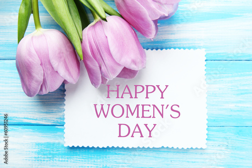 Fototapeta Naklejka Na Ścianę i Meble -  Beautiful bouquet of purple tulips and blank card