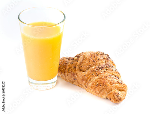 Crispy fresh croissant with orange juice