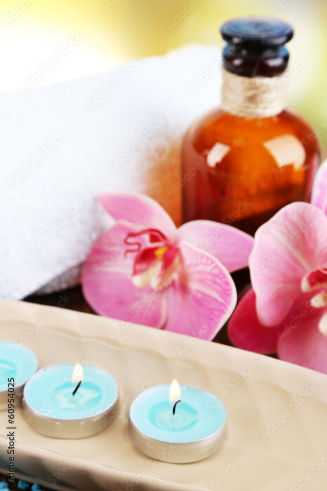 Beautiful spa setting with flower on bright background Beautiful spa setting with flower on bright background
