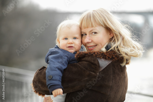 Happy mother with her little son outdoor