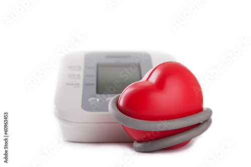 electronic blood pressure meter and red heart