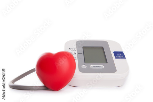 red heart in front of blood pressure meter