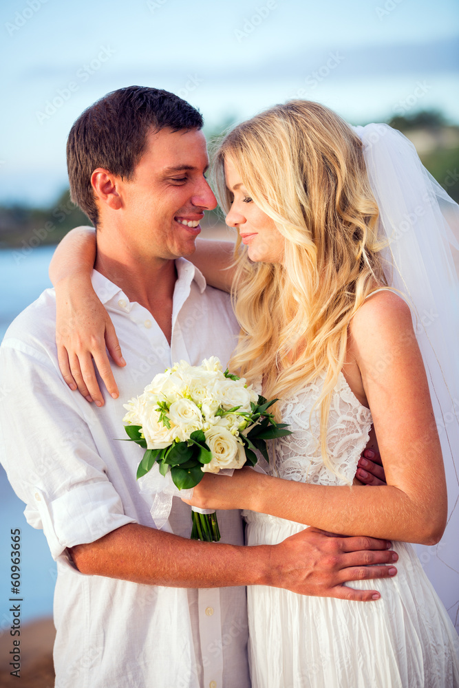 bride and groom at sunset on tropical beach bride and groom at sunset on tropical beach