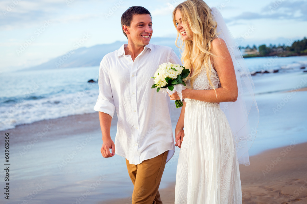 bride and groom at sunset on tropical beach