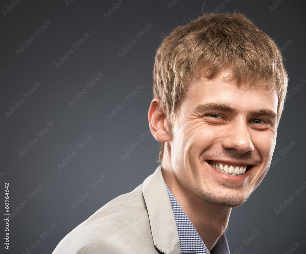 Fototapeta premium Businessman isolated studio portrait on gray