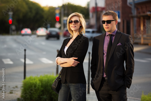 Young business couple on the city street