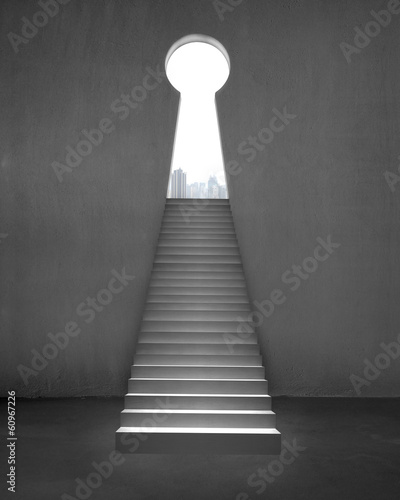 Key shape door on concrete wall with stairs and city view outsid photo