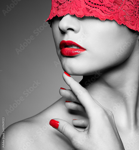 woman with red lacy ribbon on eyes