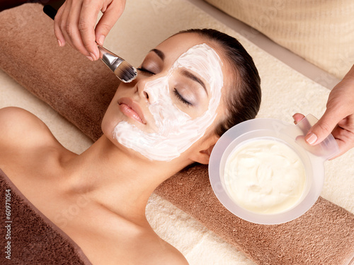 Canvas Print Spa therapy for woman receiving facial mask