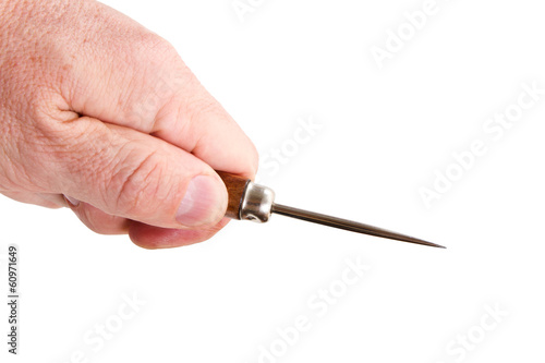 hand with a sharp pricker