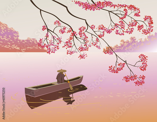 Sakura . A lone boatman, floats on the the lake in the spring.
