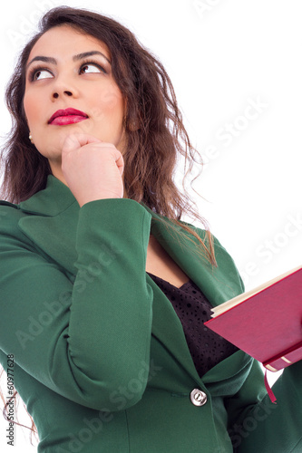 Portrait of a beautiful young woman holding a book