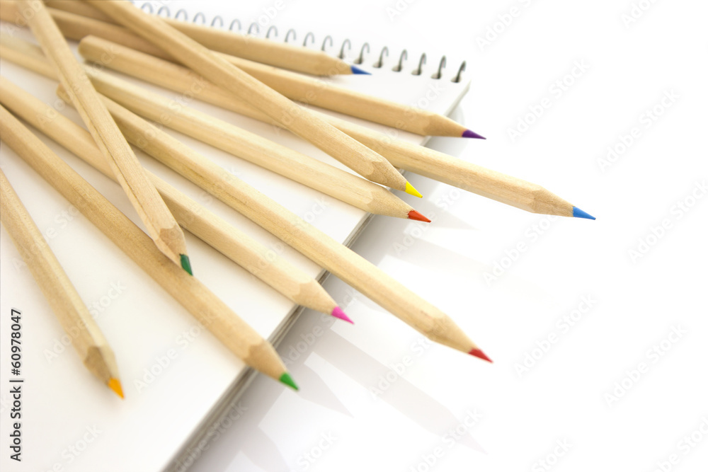 Color pencils on sketchbook isolated Color pencils on sketchbook isolated
