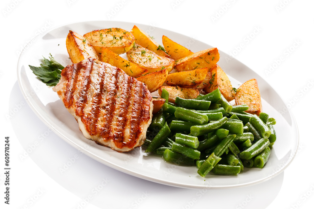 Grilled steak, baked potatoes and vegetables Grilled steak, baked potatoes and vegetables