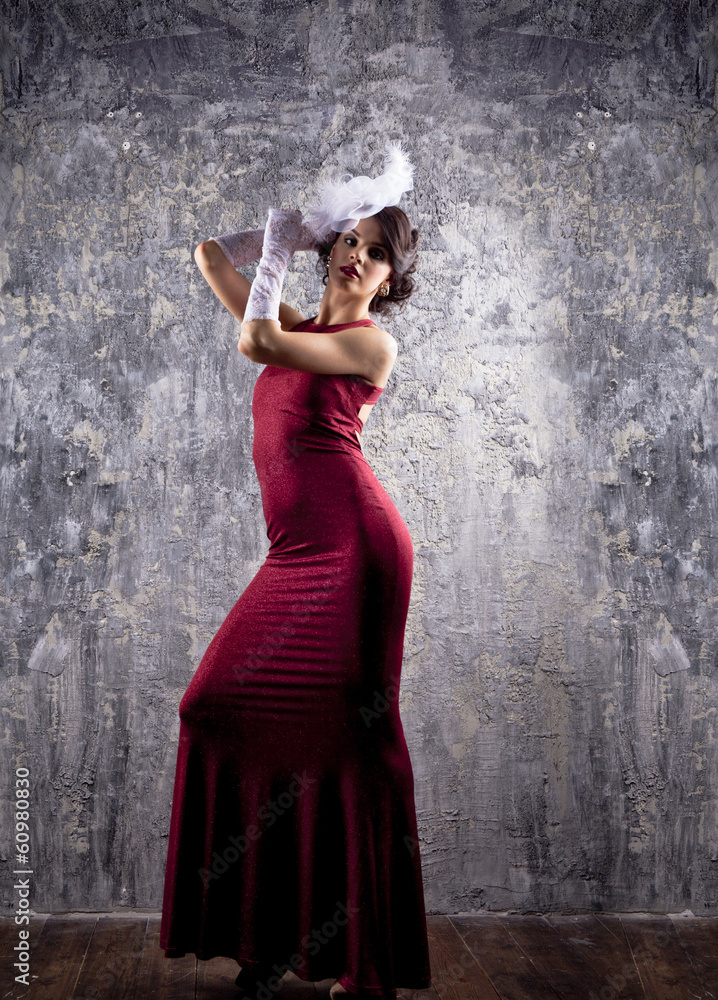 Obraz premium Fashion model in long red dress
