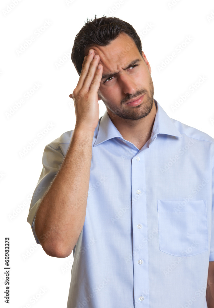 Latin man in a blue shirt feels sad Latin man in a blue shirt feels sad