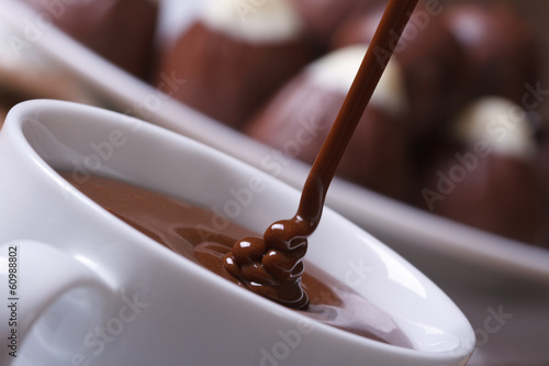 stream chocolate being poured into a cup