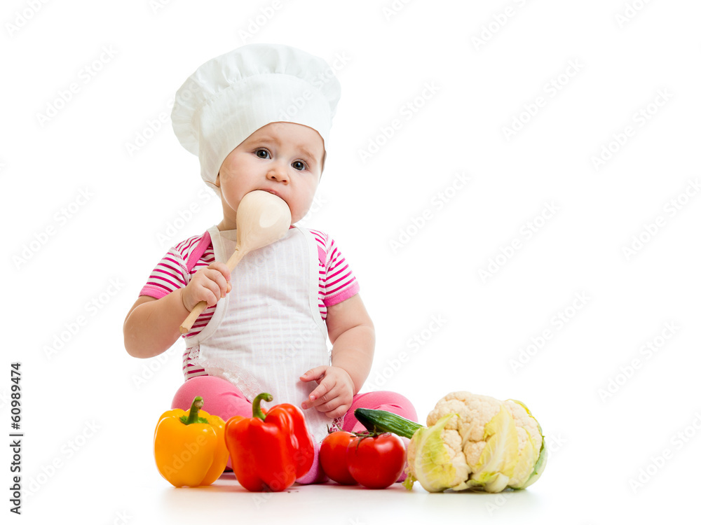 baby weared as cook with wooden spoon and vegetables baby weared as cook with wooden spoon and vegetables