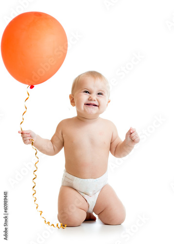 Smiling baby girl with red ...