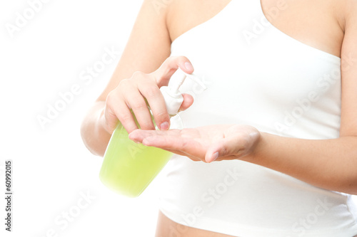Liquid soap in female hands