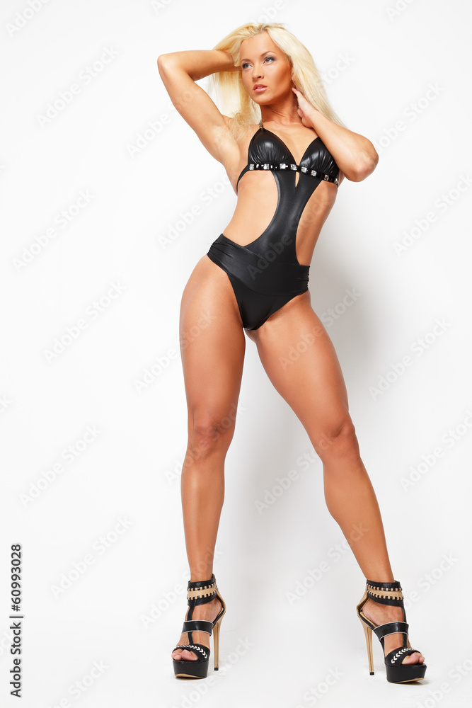 Sexy blonde girl looking away in swimsuit and heels Sexy blonde girl looking away in swimsuit and heels
