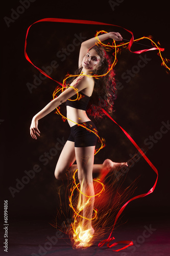 young girl dancing with fire © carman