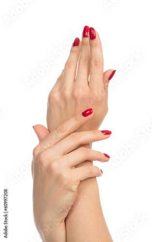 Obraz na plátně Woman hands with manicured red nails