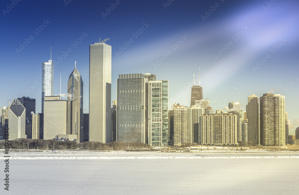 Downtown Chicago in winter with frozen lake Downtown Chicago in winter with frozen lake
