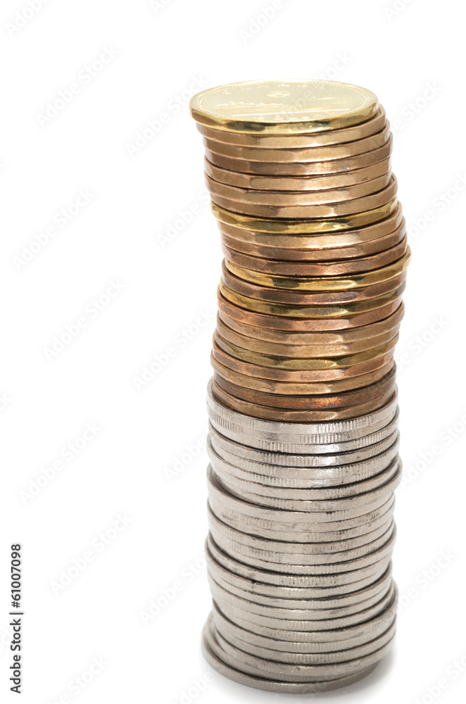 Canadian dollar coins stacked on white background Canadian dollar coins stacked on white background