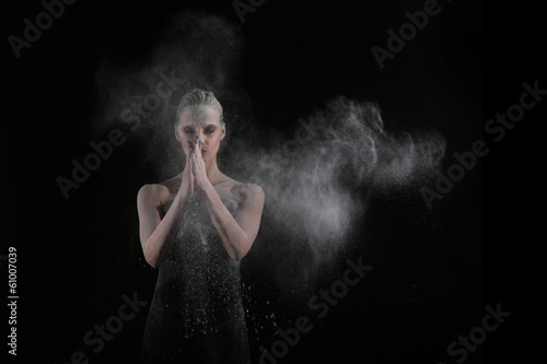 Woman With Stop Motion of Explosive Powder Captured by Flash
