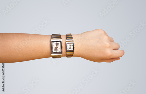 Hand with watch showing precise time