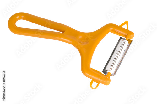 Photography The orange plastic vegetable peeler isolated on white