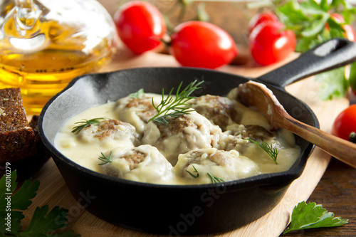 Swedish meatballs in a creamy sauce. photo