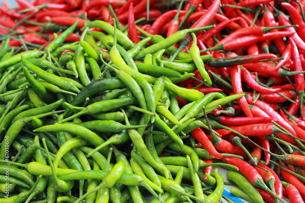 Green chili and red chili on the market. Green chili and red chili on the market.