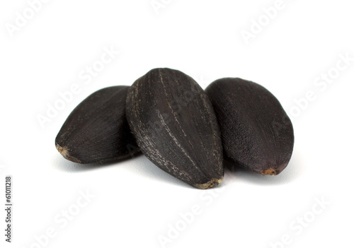 Fotografie Sunflower seeds isolated on white background
