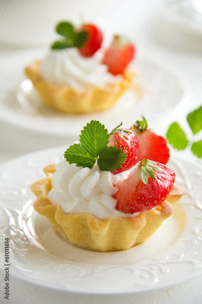 Tartlets with whipped cream and strawberries. Tartlets with whipped cream and strawberries.